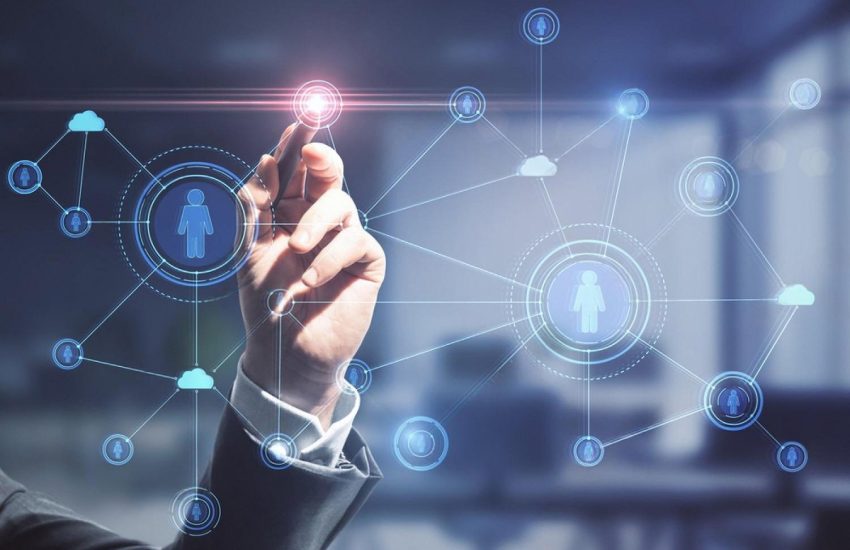 Businessman touching a digital network of connected users, representing managed IT services in Dubai